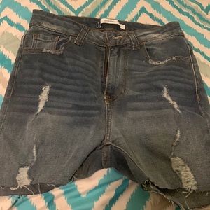 A blue ripped shorts